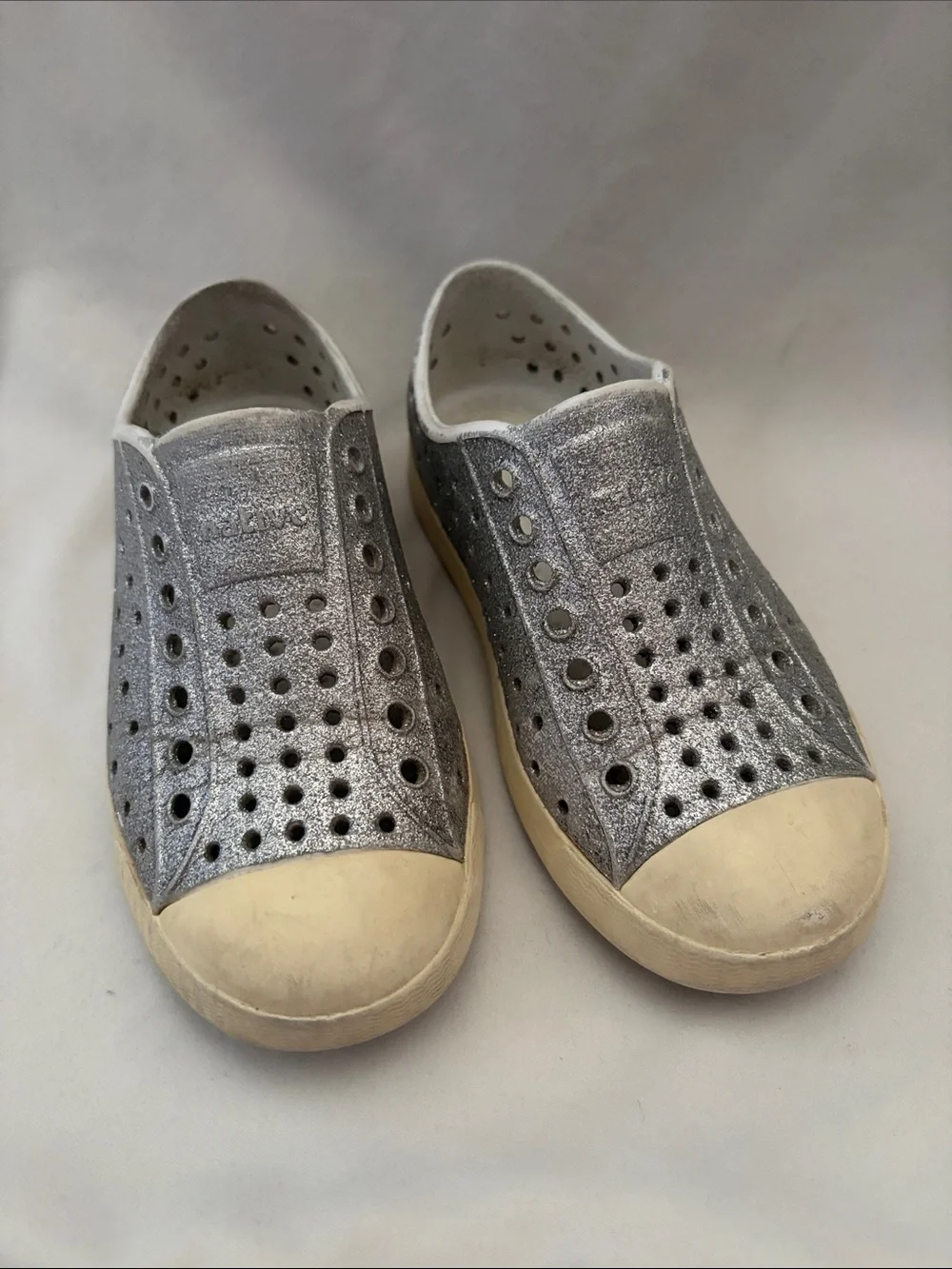 Native Gray Slip-On Kids Shoes with Cream Soles and Teal Heel Logo